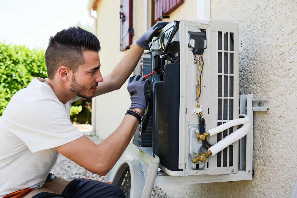 Technician checking heater in RGV home